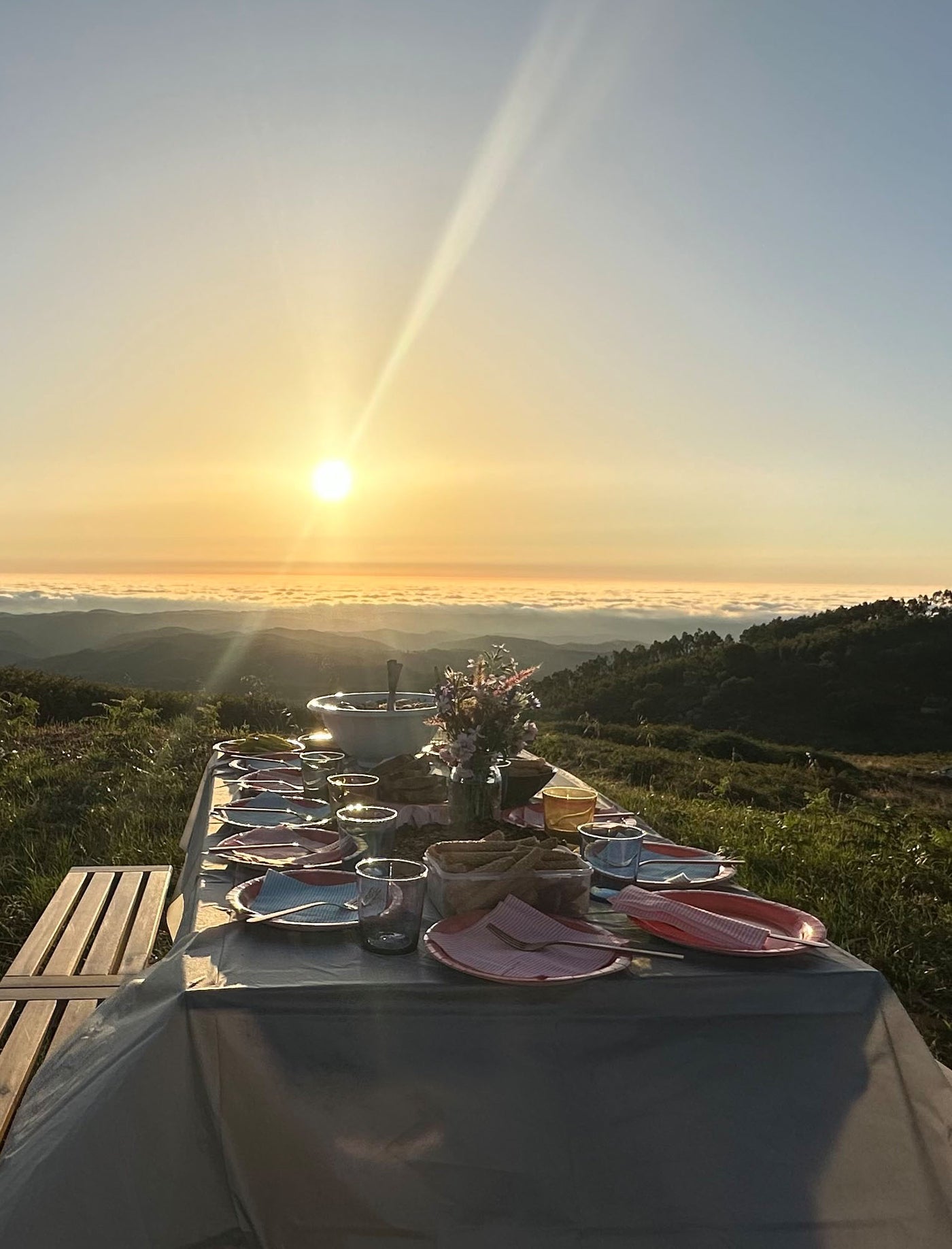 A curated sunset table setting in warm evening light